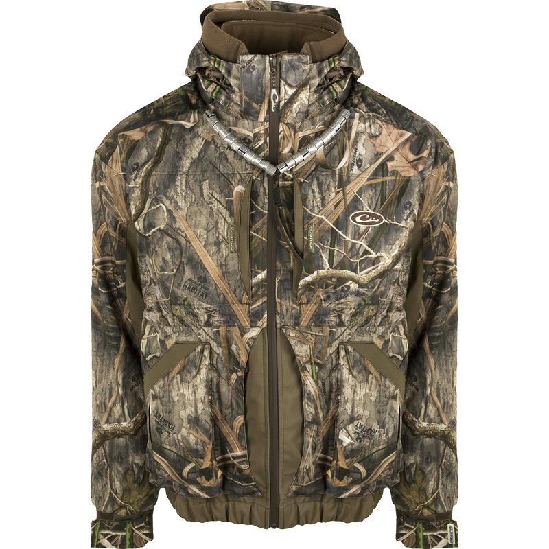 A versatile camouflage jacket with zip-in liner for increased flexibility and customization. Designed for hunters, it offers unparalleled protection with waterproof/windproof/breathable fabric and fowl-proof pockets. The LST Refuge™ 3.0 3-in-1 Jacket from Drake Waterfowl.
