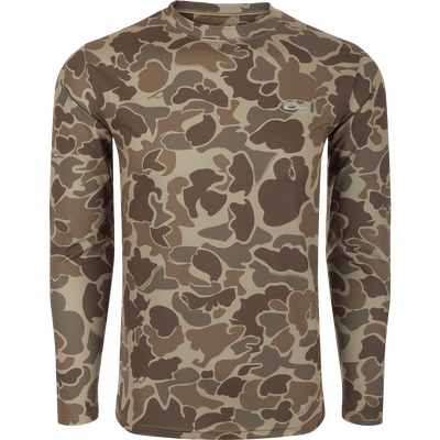A long sleeved shirt with a camouflage pattern, designed for optimum comfort and durability. Made with 92% Polyester/8% Spandex and 4-Way Stretch for superior flexibility and protection. Features Shield 4 Sun™ UPF 50+, Shield 4 Coolant™, Shield 4 Odor™, and Shield 4 Stains™ treatments for effective sun, heat, odor, and stain protection.