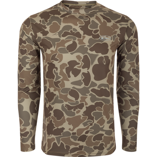 A long sleeved shirt with a camouflage pattern, designed for optimum comfort and durability. Made with 92% Polyester/8% Spandex and 4-Way Stretch for superior flexibility and protection. Features Shield 4 Sun™ UPF 50+, Shield 4 Coolant™, Shield 4 Odor™, and Shield 4 Stains™ treatments for effective sun, heat, odor, and stain protection.