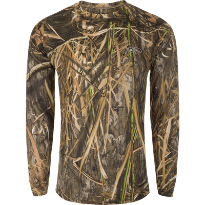 A long sleeved shirt with a camouflage pattern, designed for optimum comfort and durability. Made of 92% Polyester/8% Spandex with 4-Way Stretch for flexibility and protection. Features Shield 4 Sun™ UPF 50+, Shield 4 Coolant™, Shield 4 Odor™, and Shield 4 Stains™ treatments for effective sun, heat, odor, and stain protection. EST Camo Performance Crew L/S from Drake Waterfowl.