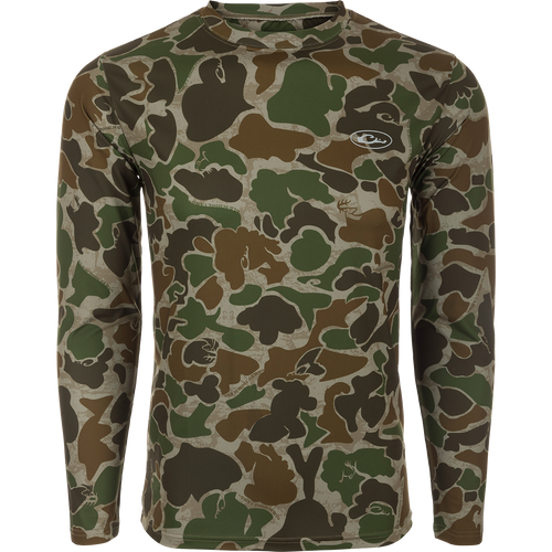EST Camo Performance Crew L/S: A durable, flexible camouflage shirt with 4-way stretch and UPF 50+ sun protection. Features Shield 4 Coolant™, Shield 4 Odor™, and Shield 4 Stains™ treatments for added comfort and freshness. Ideal for hunting and outdoor activities.