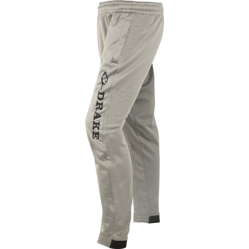 A pair of MST Fleece Wader Pants, made of 100% Polyester Fleece for warmth and comfort. Features include front handwarmer pockets, elastic waist, and snug fit tapered ankles. Ideal for wearing under waders.