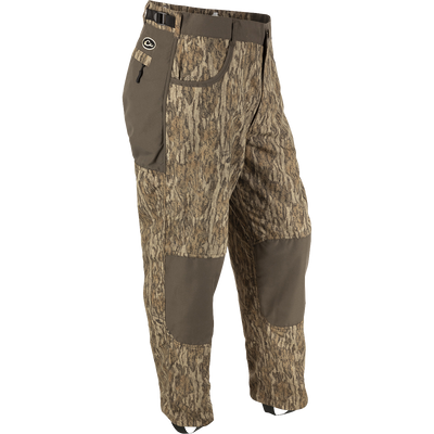 MST Jean Cut Wader Pant: Camouflage pant with adjustable waist and ankle cords. Water-resistant, windproof, and breathable Refuge HS™ fabric. Front slash and zippered rear pockets. Ideal for hunting and fishing.