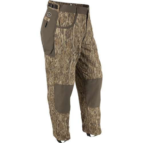 MST Jean Cut Wader Pant: Camouflage pant with adjustable waist and ankle cords. Water-resistant, windproof, and breathable Refuge HS™ fabric. Front slash and zippered rear pockets. Ideal for hunting and fishing.