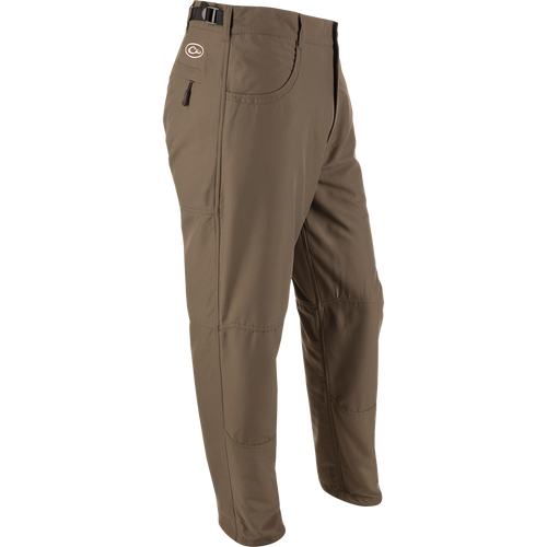 MST Jean Cut Wader Pant: Brown trousers with pockets, adjustable waist, and ankle cord locks. Ideal for outdoor activities and wearing under waders.