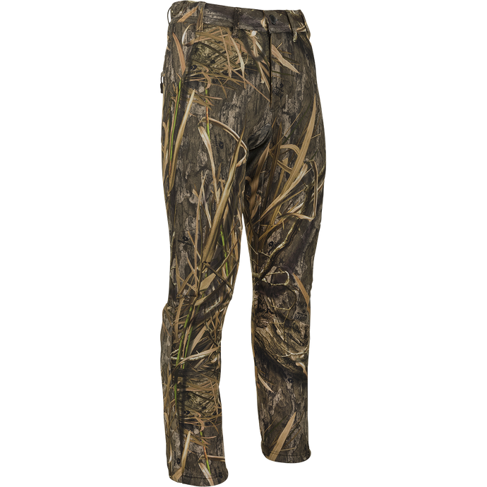 MST Ultimate Wader Pants: Camouflage pants with adjustable ankle fit for wader use or casual wear. Made of polyester fleece with Sherpa fleece lining. Features side-elastic waist, silicone grip waistband, 4-way stretch, gusseted crotch, articulated knees, and zippered rear security pockets.