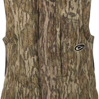 MST Ultimate Wader Bib: A camouflage vest with Sherpa-lined pockets and zippered security pockets for storage. Four-way stretch material and articulated knees for easy movement.