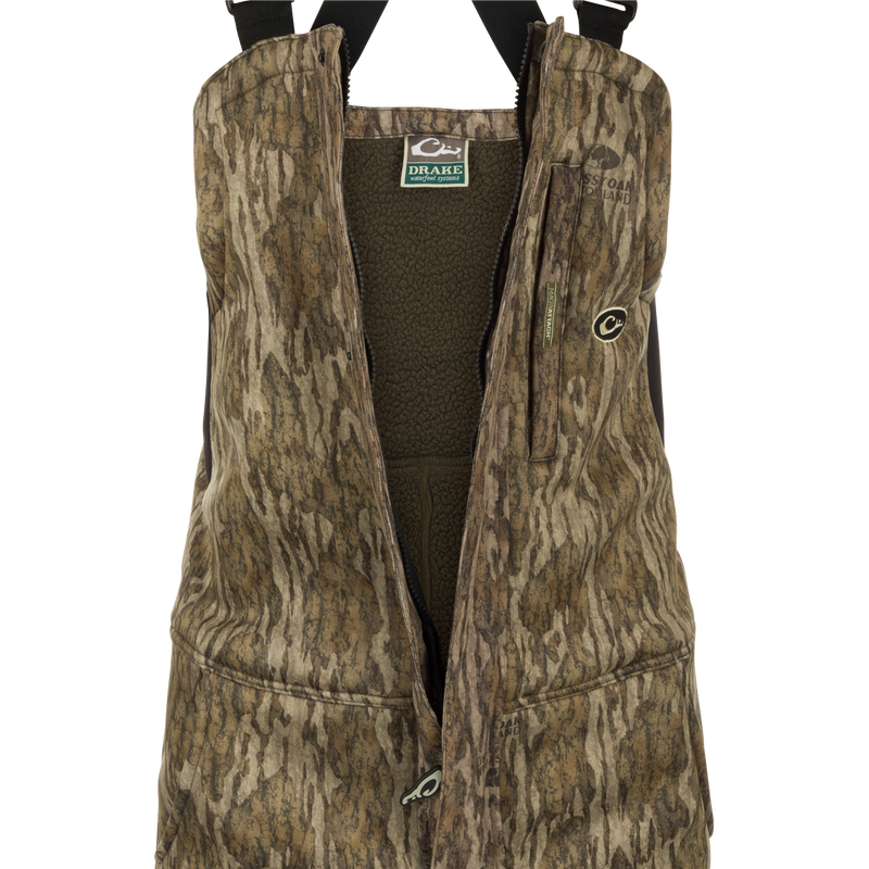 MST Ultimate Wader Bib: A vest with a logo and multiple pockets for storage. Made of polyester fleece with a Sherpa fleece lining.