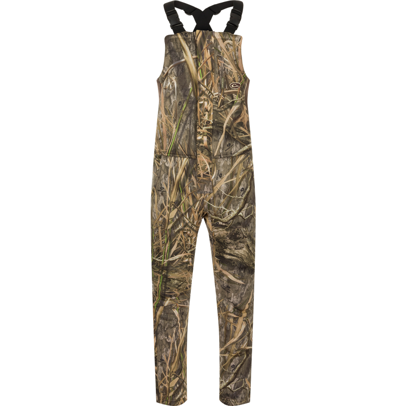 MST Ultimate Wader Bib: Camouflage overalls with shorts, suspenders, and multiple pockets for storage. Four-way stretch material, gusseted crotch, and articulated knees for easy movement. Sherpa-lined handwarmer pockets and zippered rear security pockets. Ankle-fit for under waders.