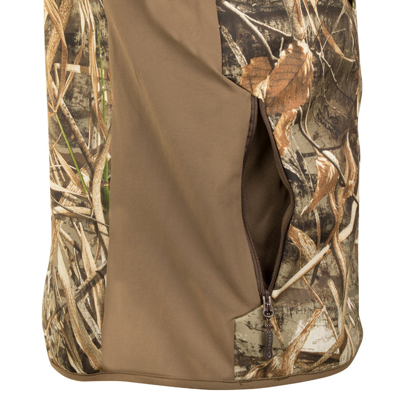 A close-up of the EST Camo Windproof Tech Vest, a camouflage cover with a zipper. This versatile accessory is perfect for hunting and outdoor activities.
