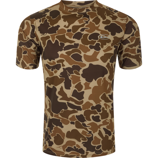 A close-up of a Youth EST Camo Performance Short Sleeve Crew shirt on a mannequin, showcasing its 4-Way Stretch capabilities and Shield 4 Sun™ UPF 50+ Treatment for outdoor activities.