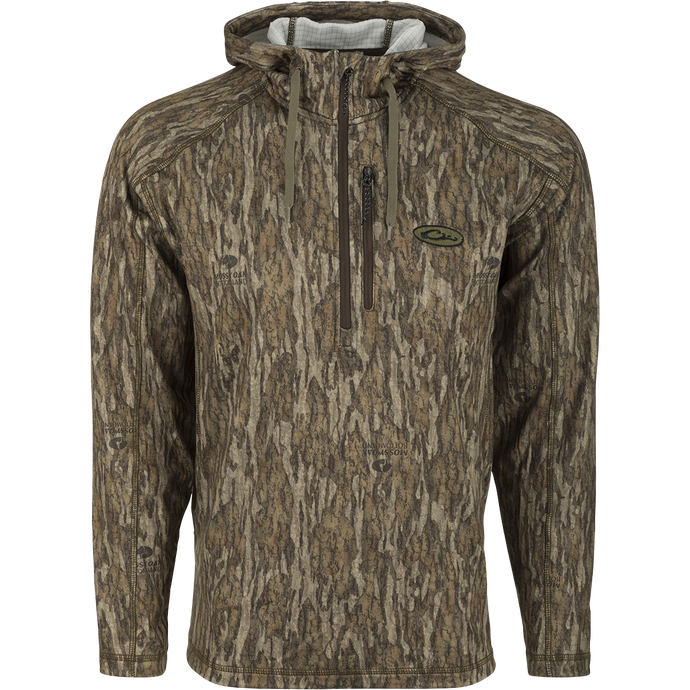 MST Breathelite 1/4-Zip Camo Hooded Base Layer, a camouflage jacket with raglan sleeves and a soft hooded design for added warmth.