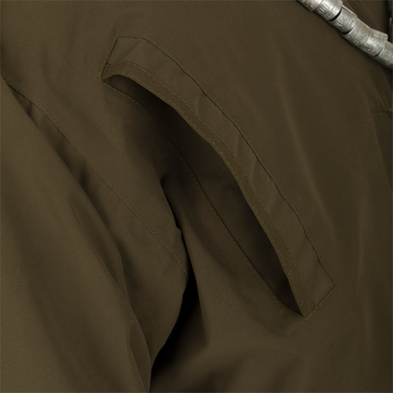 MST Waterproof Fleece-Lined 1/4 Zip Jacket: A close-up of a khaki jacket with adjustable cuffs, multiple pockets, and a rear storage pouch.
