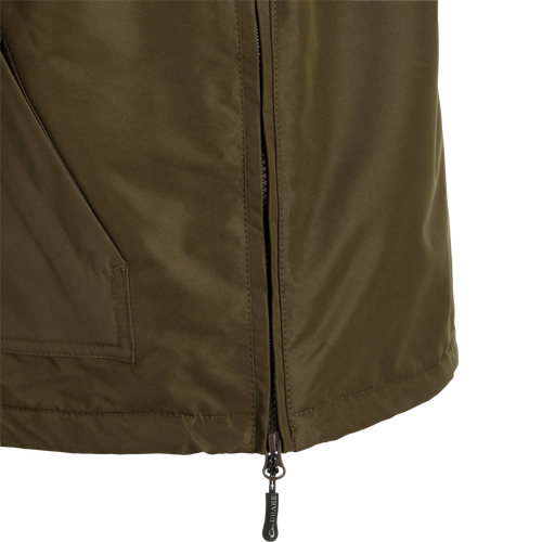 MST Waterproof Fleece-Lined 1/4 Zip Jacket: A close-up of a khaki jacket with a zipper and clip. Ideal for hardcore hunters, it offers protection from the elements with adjustable cuffs, extendable collar, and multiple pockets for storage.