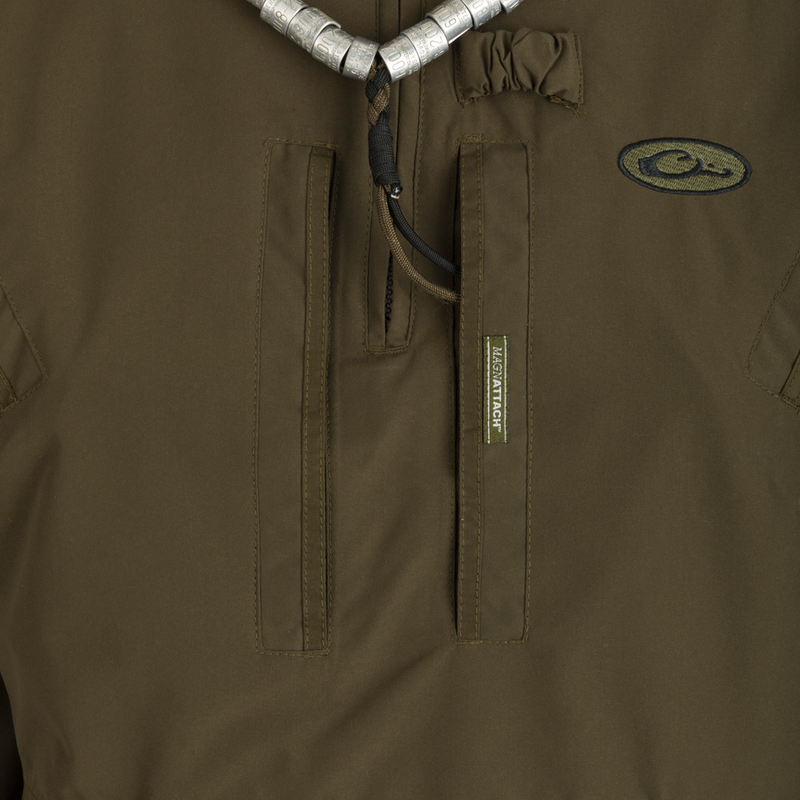 MST Waterproof Fleece-Lined 1/4 Zip Jacket: A close-up of a khaki jacket with logo, adjustable cuffs, and multiple pockets for secure storage and comfort.