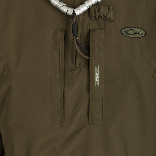 MST Waterproof Fleece-Lined 1/4 Zip Jacket: A close-up of a khaki jacket with logo, adjustable cuffs, and multiple pockets for secure storage and comfort.