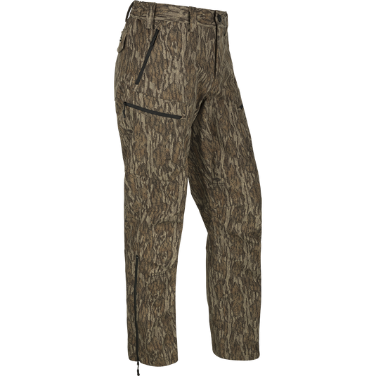 MST Softshell Waterfowler Pants - Camouflage pants with secure pockets, articulated knees, and lower-leg zips for easy on/off over boots. Versatile and comfortable hunting pants for mid-season and late-season hunts.