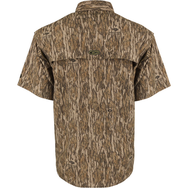 Back view of the EST Camo Wingshooter's Shirt S/S, a lightweight and breathable shirt designed for dove hunts, teal and goose hunts, or the shooting range. Features include vents, breathable mesh, Magnattach pocket, heat vents, sun blocker collar, and large chest pockets.