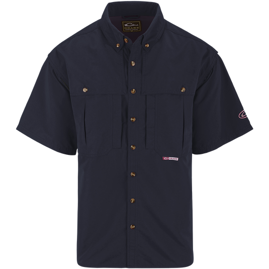 Solid Wingshooter's Shirt S/S: Breathable, quick-drying shirt with front and back ventilation. Features oversized chest pockets, Magnattach™ pocket, and sun blocker collar. Perfect for field or water activities.