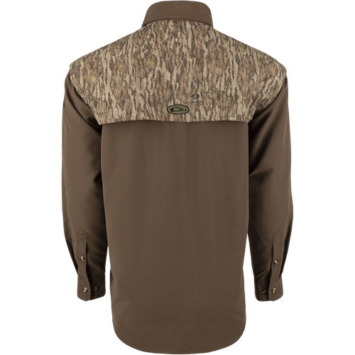 A lightweight, breathable Wingshooter's Shirt with a camouflage design. Features vents, mesh lining, and button tabs on sleeves for comfort and style. Perfect for hunting and shooting activities.