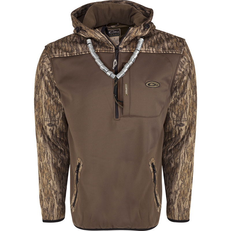 MST Endurance Soft Shell Hoodie: A brown jacket with a silver necklace, featuring a deep quarter-zip neck, Magnattach™ pocket, lower zipped pockets, and mesh-lined sleeves for easy on/off. Fleece-lined hood with drawstring and elastic waist hem.