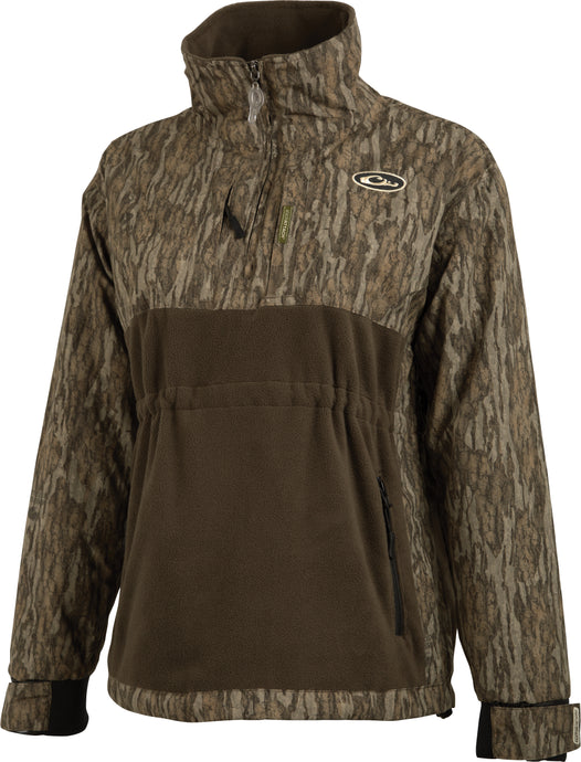 A brown and brown jacket with camouflage pattern, featuring Eqwader™ technology for comfort and performance. Waterproof/windproof/breathable fabric on sleeves and upper body, ultra-breathable fleece on lower body. Magnattach™ pocket, adjustable neoprene cuffs, and zippered pockets. MST Women’s Eqwader 1/4 Zip Jacket by Drake Waterfowl.