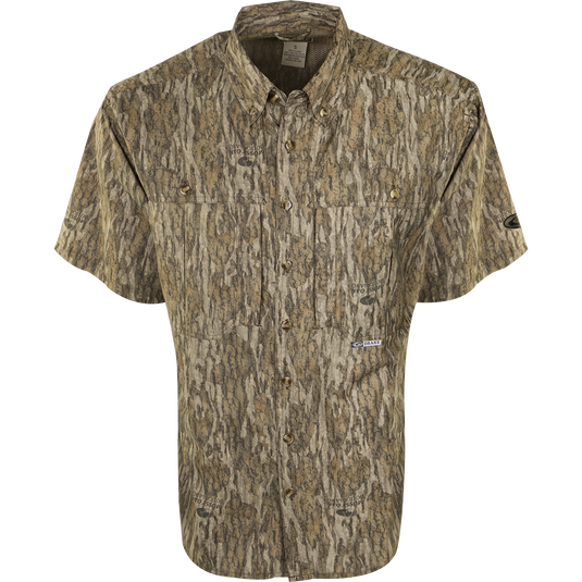 A close-up of the EST Camo Flyweight Wingshooter's Shirt, a lightweight and breathable hunting shirt with moisture-wicking properties. Features include UPF 50+ sun protection, back heat vents, mesh panels, and multiple chest pockets. Perfect for early season hunting.