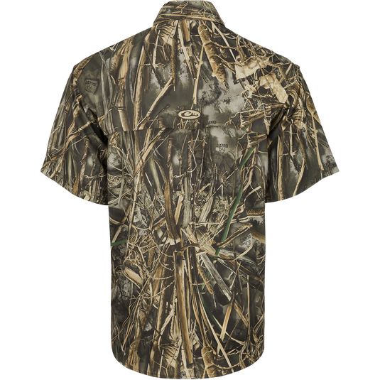 Back view of the EST Camo Flyweight Wingshooter's Shirt S/S, a lightweight and breathable hunting shirt. Made of 100% polyester Flyweight fabric with Sol-Shield™ UPF 50+ sun protection. Features include back heat vents, mesh side panels, Magnattach™ vertical chest pocket, and quick-drying properties. Perfect for early season hunts.