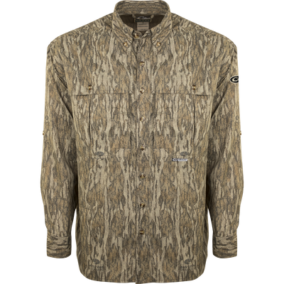 A lightweight, breathable EST Camo Flyweight Wingshooter's Shirt with a camouflage pattern. Made of 100% polyester for quick drying and moisture-wicking. Features include UPF 50+ sun protection, vented mesh back, and multiple chest pockets. Perfect for early season hunting.
