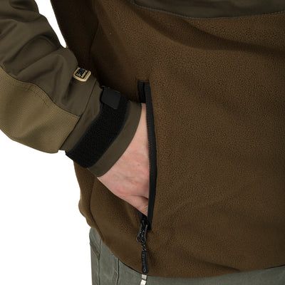 A person wearing the MST Guardian Eqwader Flex Fleece Full Zip Jacket, with hand in pocket, showcasing waterproof/windproof/breathable fabric and reinforced elbow protection.