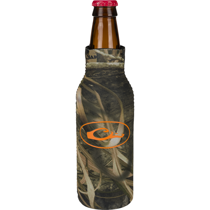 A Bottle Cooler featuring a camouflage cover and an orange logo with a leaf. It has a side zipper for a snug fit and a separate bottom piece to prevent tipping over. Keep your favorite bottled beverage cold and showcase your love for the outdoors with this Drake Waterfowl product.