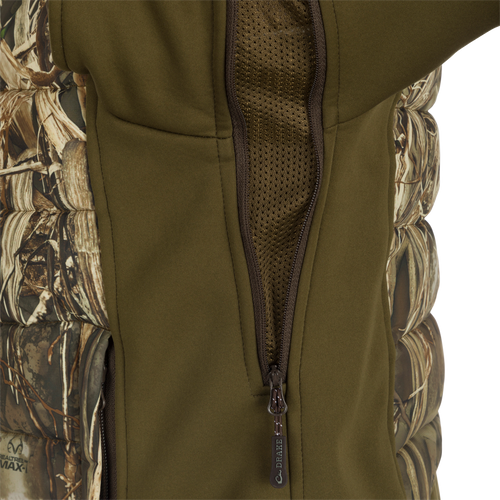 LST Double Down Endurance Hybrid Liner: A vest with a zipper and camouflage fabric, offering warmth and comfort with synthetic down insulation. Features include elasticated cuffs, adjustable waist, and zippered pockets.