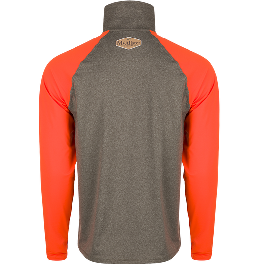 A versatile and comfortable McAlister EST 1/4 Zip Performance Upland Shirt with 4-way stretch and moisture-wicking properties. Features raglan sleeves, YKK zipper, and integrated thumb loops. Hi-Vis Blaze Orange shoulders and arms. Ideal for layering or wearing alone.