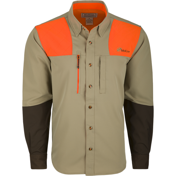 McAlister MST Upland Tech Shirt: A long-sleeved shirt with orange and black stripes, featuring a collar, button, and abrasion-resistant forearm. Includes chest pockets and an integrated lens cloth. Made of nylon, Spandex, and polyester. Ideal for hunting and outdoor activities.