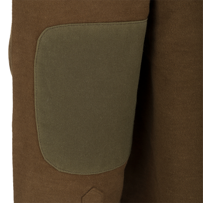 A close-up of the McAlister Windproof Moleskin Jac-Shirt, showcasing its brown fabric and Dry Waxed 100% Canvas Elbow Patches.