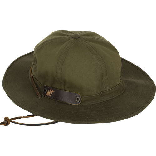 A McAlister Waterfowler's Hat, made of 10.10 oz Waxed Canvas with a cotton lining. Features a shapable brim, leather chin strap, and ventilation grommets.