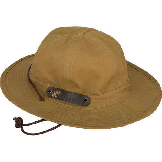 McAlister Waterfowler's Hat: A brown waxed canvas hat with a shapable brim, leather chin strap, and ventilation grommets.