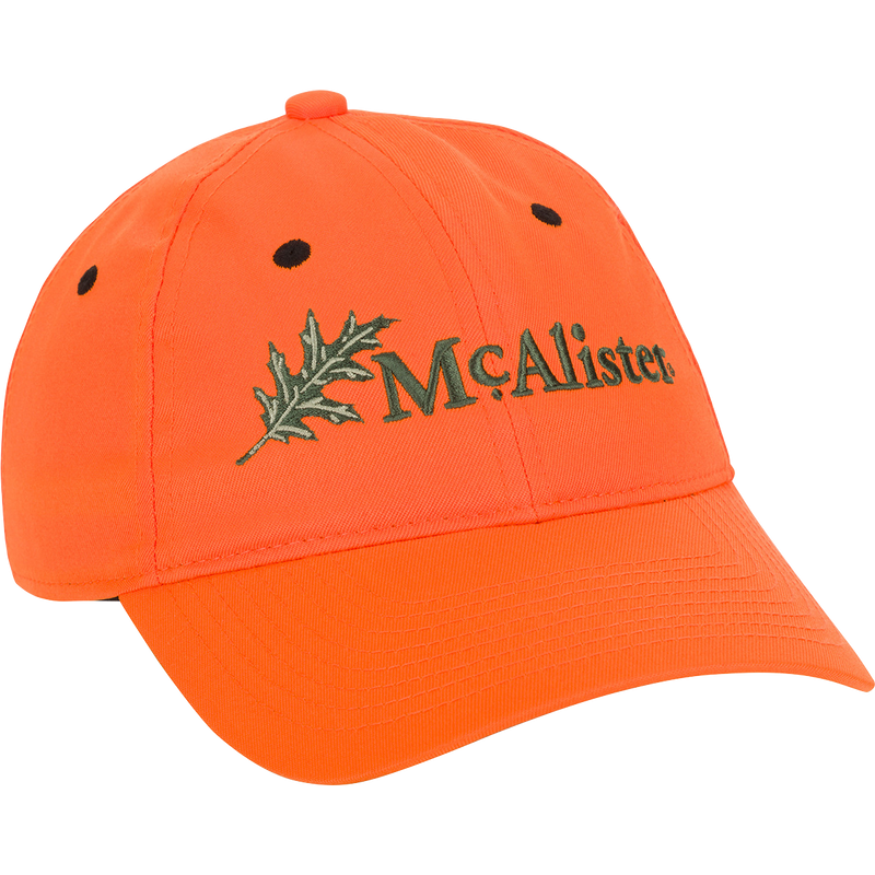 McAlister Upland Embroidered Twill Cap: A low-profile baseball cap with an embroidered logo featuring a maple leaf. Adjustable Velcro closure for a perfect fit.