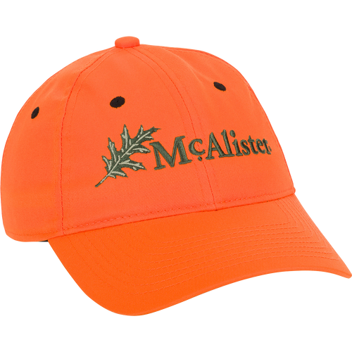McAlister Upland Embroidered Twill Cap: A low-profile baseball cap with an embroidered logo featuring a maple leaf. Adjustable Velcro closure for a perfect fit.
