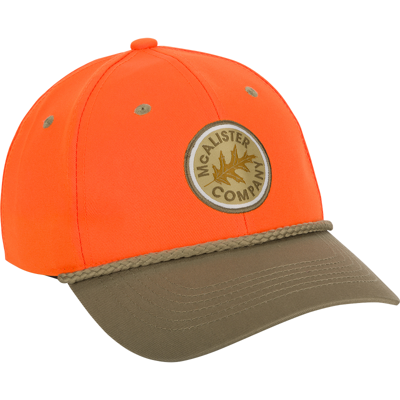 McAlister Traditional Upland Twill Cap with logo patch and adjustable closure. Classic upland hunter look with contrasting bill and rope.