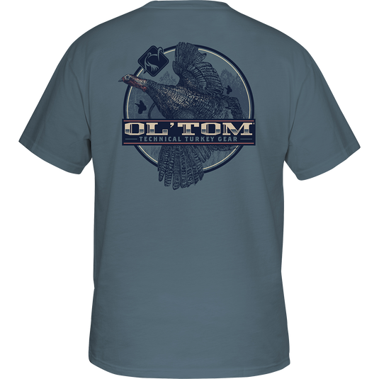 Ol' Tom Camber Flight T-Shirt: Back of a grey shirt with a turkey graphic. Ol' Tom logo on front pocket. Vintage Ol' Tom Series. Cotton/polyester blend. Lightweight.