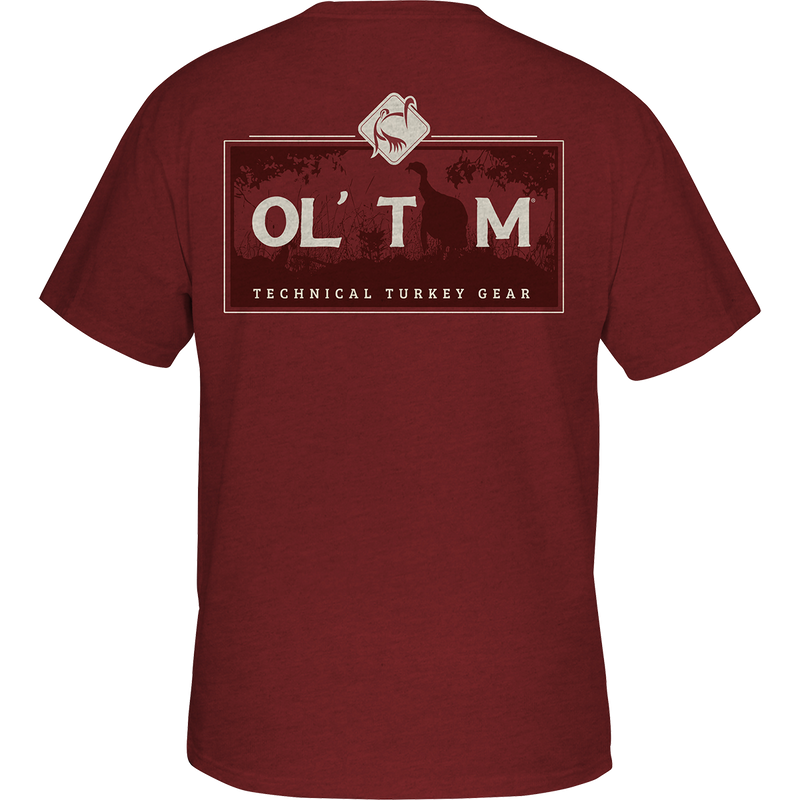 Ol' Tom Box Gobbler T-Shirt: A red shirt with Ol' Tom logo on the front pocket, featuring a scene from the Vintage Ol' Tom Series of back graphic tees.