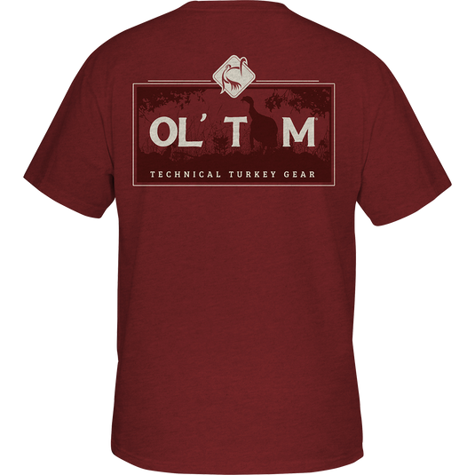 Ol' Tom Box Gobbler T-Shirt: A red shirt with Ol' Tom logo on the front pocket, featuring a scene from the Vintage Ol' Tom Series of back graphic tees.