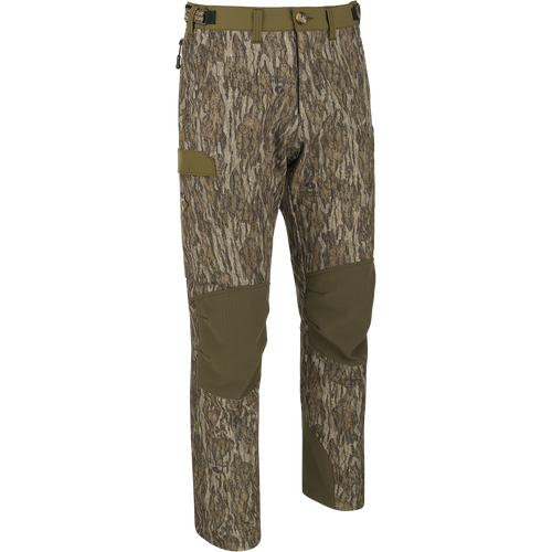 A pair of lightweight, moisture-wicking Men's Tech Stretch Turkey Pants with reinforced knees and gusseted crotch for comfort during extended periods of sitting. Features adjustable waistband, mesh pockets, and cargo pockets for storage. Ideal for spring turkey season.