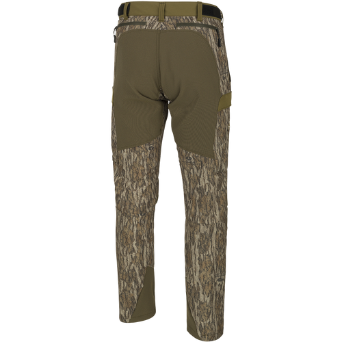 A pair of men's Tech Stretch Turkey Pants, designed for spring turkey season. Lightweight, moisture-wicking, and abrasion-resistant with 4-way stretch technology. Features reinforced knees, ankles, and bottom, gusseted crotch for comfort, and adjustable waistband. Mesh and zippered pockets for ventilation and storage. Ideal for hunting and outdoor activities.