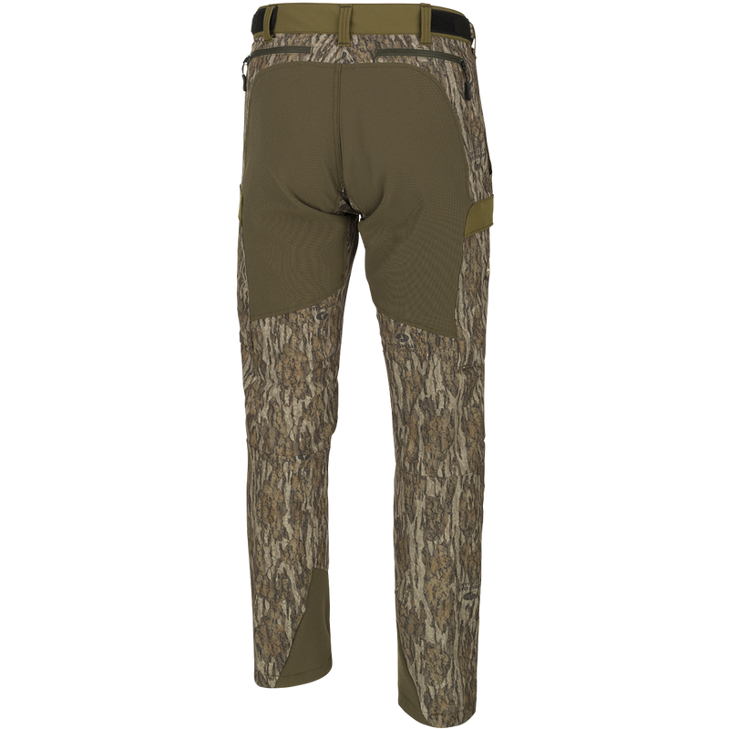 A pair of men's Tech Stretch Turkey Hunting Pants, designed for spring turkey season. Lightweight, moisture-wicking, and durable with reinforced knees, ankles, and bottom. Features a relaxed fit, adjustable waistband, and multiple pockets for storage.