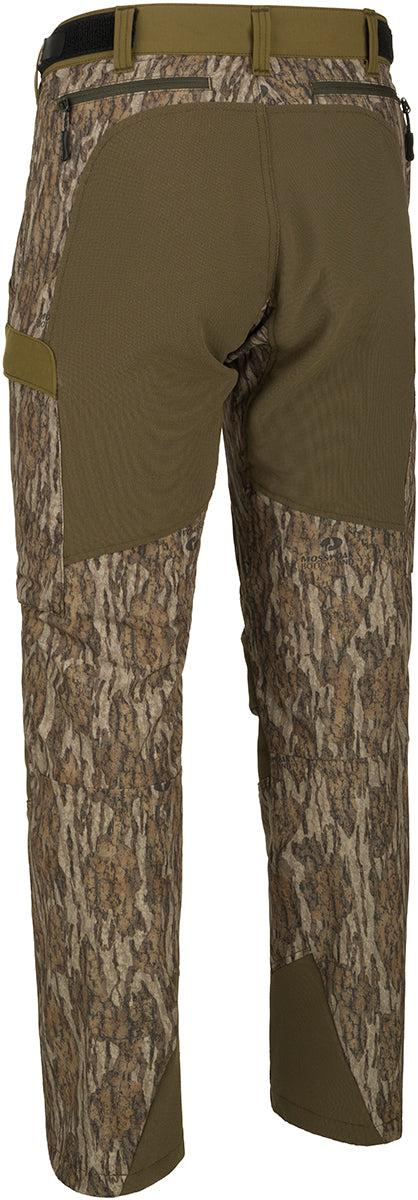 A pair of Men's Tech Stretch Turkey Hunting Pants, designed for spring turkey season. Lightweight, moisture-wicking, and durable with reinforced knees, ankles, and bottom. Features a relaxed fit, adjustable waistband, and multiple pockets for storage. Ideal for hunting and outdoor activities.