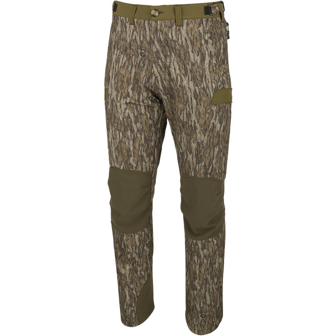 A pair of men's Tech Stretch Turkey Hunting Pants, designed for spring turkey season. Lightweight, moisture-wicking, and abrasion-resistant with 4-way stretch technology. Features reinforced knees, ankles, and bottom, gusseted crotch for comfort, and adjustable waistband. Mesh and zippered pockets for ventilation and storage. Perfect for hunting and outdoor activities.