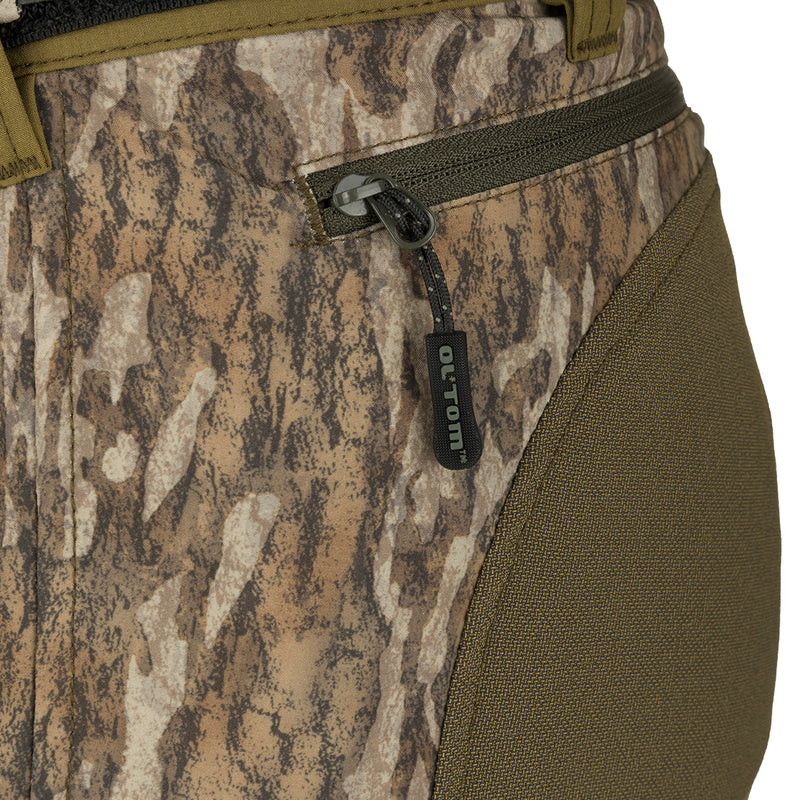 A close-up of the Men's Tech Stretch Turkey Hunting Pant, showcasing the reinforced knees, gusseted crotch, and zippered cargo pockets for storing hunting essentials.