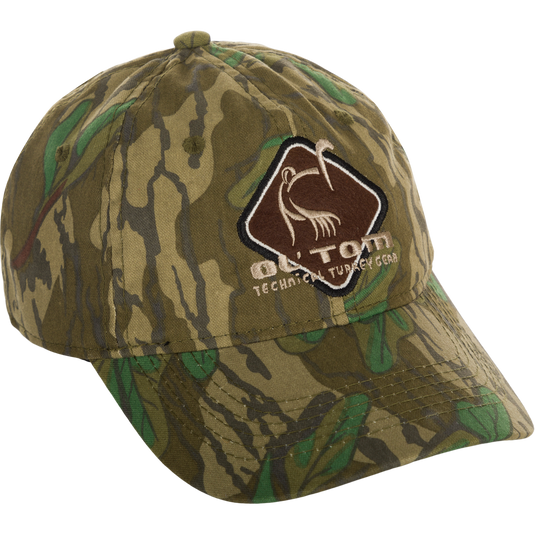 Camo Cotton Ol' Tom Diamond Logo Cap, a green hat with a logo. 100% cotton, mid-profile fit, structured front panels, hook & loop back closure.